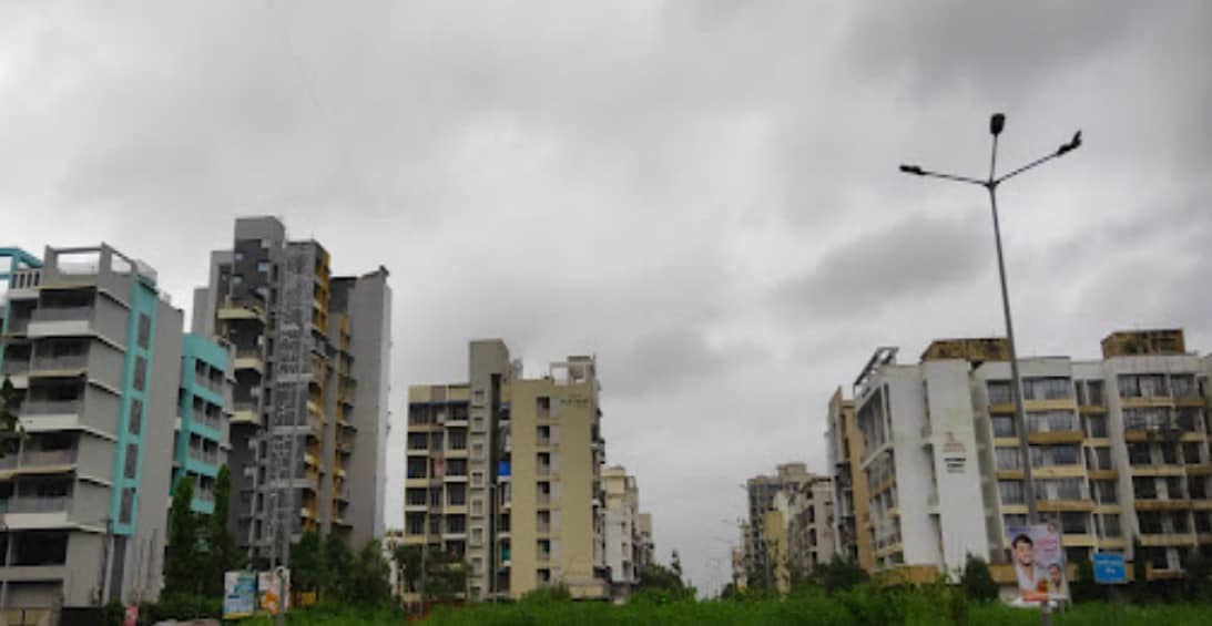 Ulwe Sector 17_a city street with buildings and a sky background
